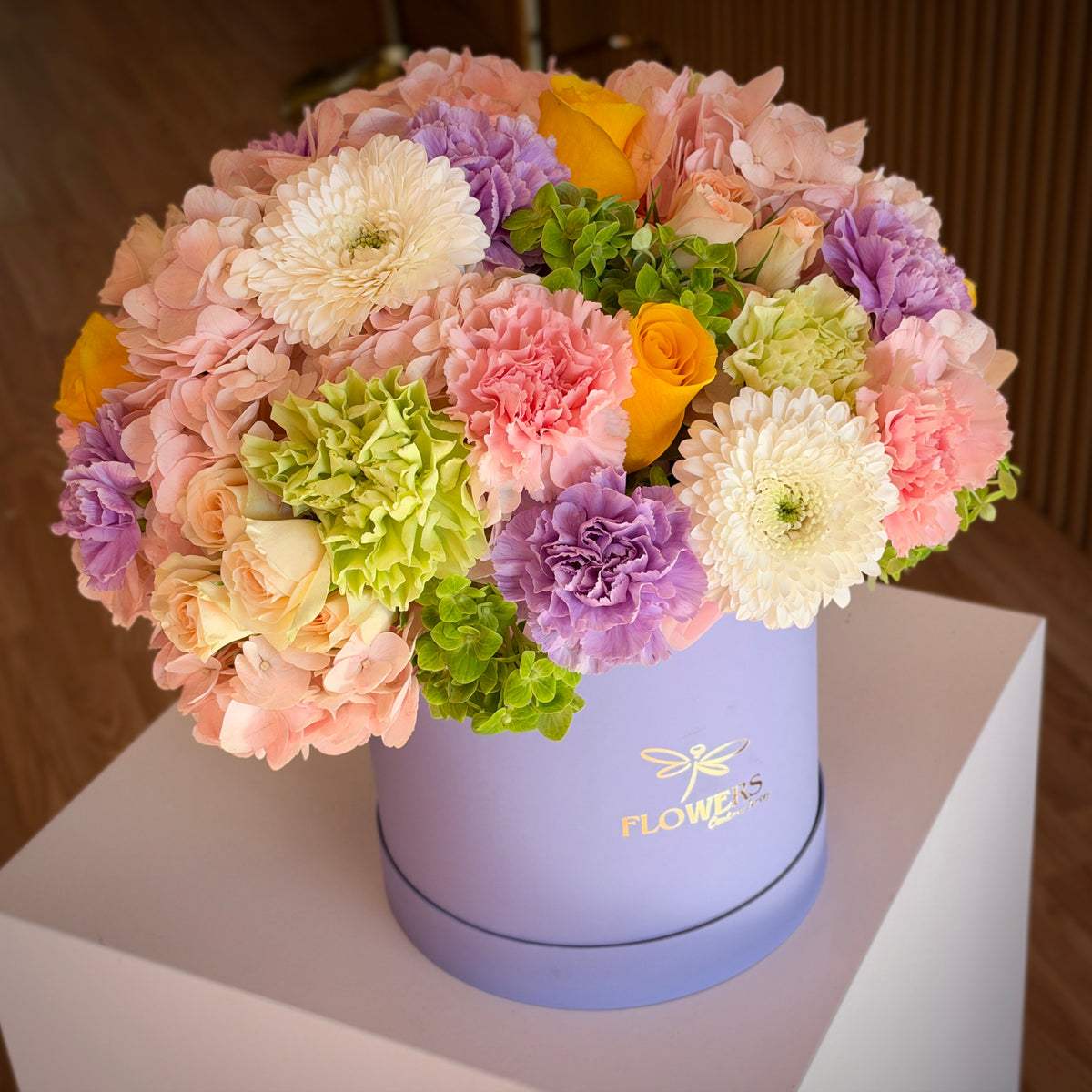 Juicy flower box from above — blush hydrangea, yellow roses and green accents